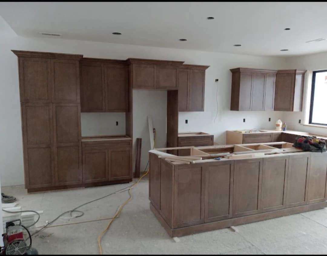 Custom dark-stained kitchen cabinetry installed by Maceri Woodworking