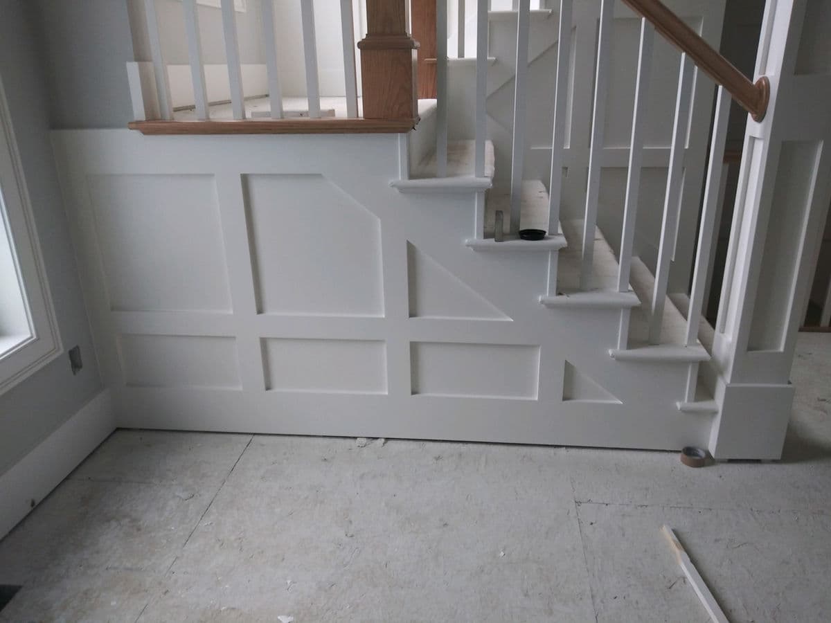 Raked Stairwell Wainscot Paneling — photo 14