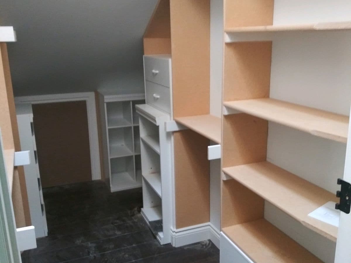 Built-In Shelving Under a Dormer — photo 24