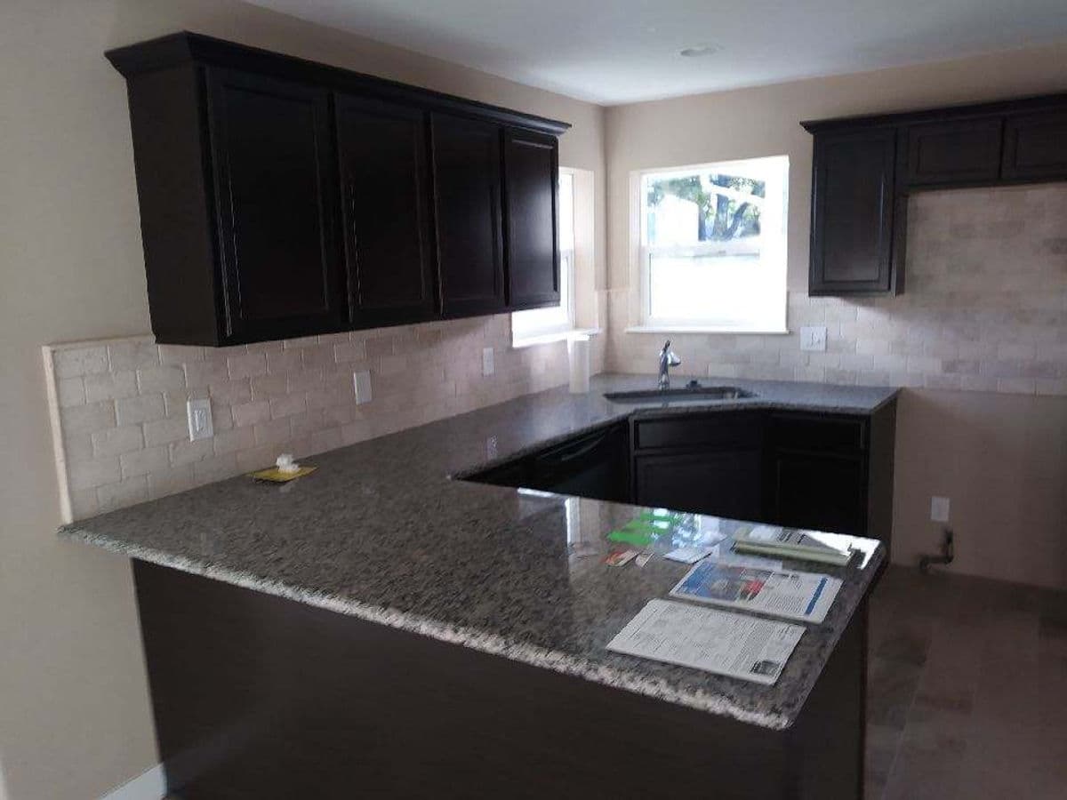 Dark Stained Kitchen & Granite Peninsula — photo 30